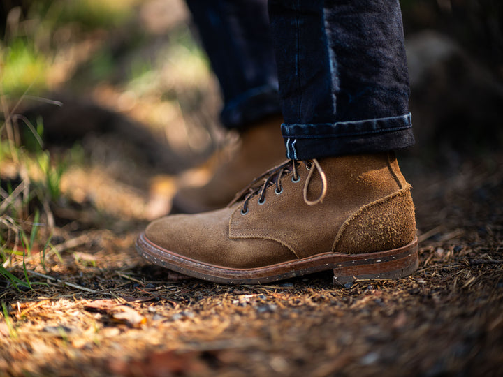 man wearing selvage denim greasepoint with Truman dark coyote rough out boots